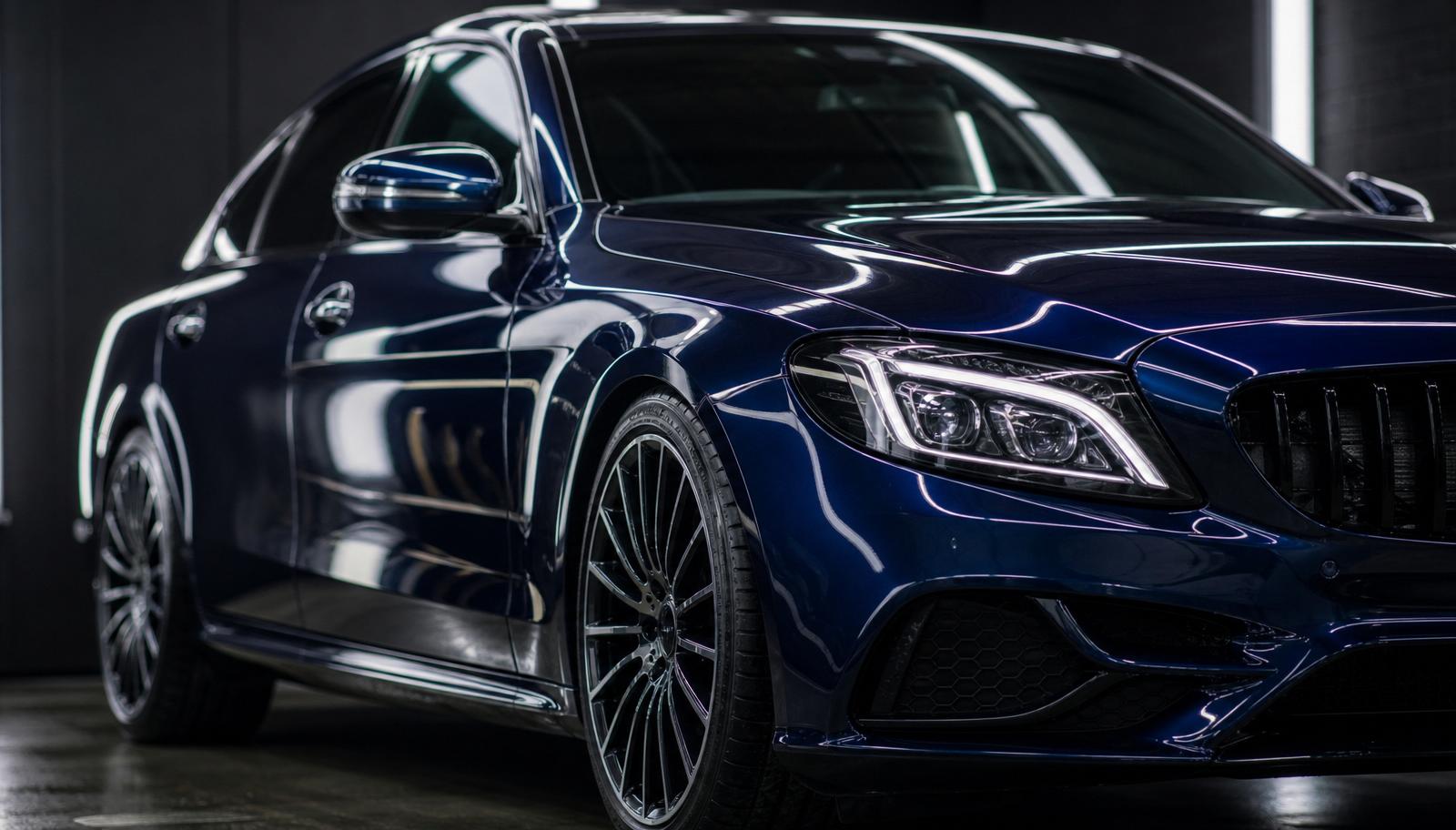 Ceramic coating being applied to a vehicle inside Carfē's Greenlane Auckland detailing studio